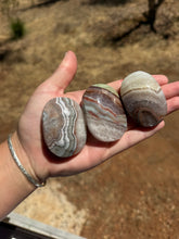 Load image into Gallery viewer, Chevron Anethyst and Crazy Lace Agate Palm Stone Intuitively Selected 15KV
