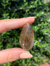 Load image into Gallery viewer, Copper Rutilated Smoky Quartz Swirl Carving